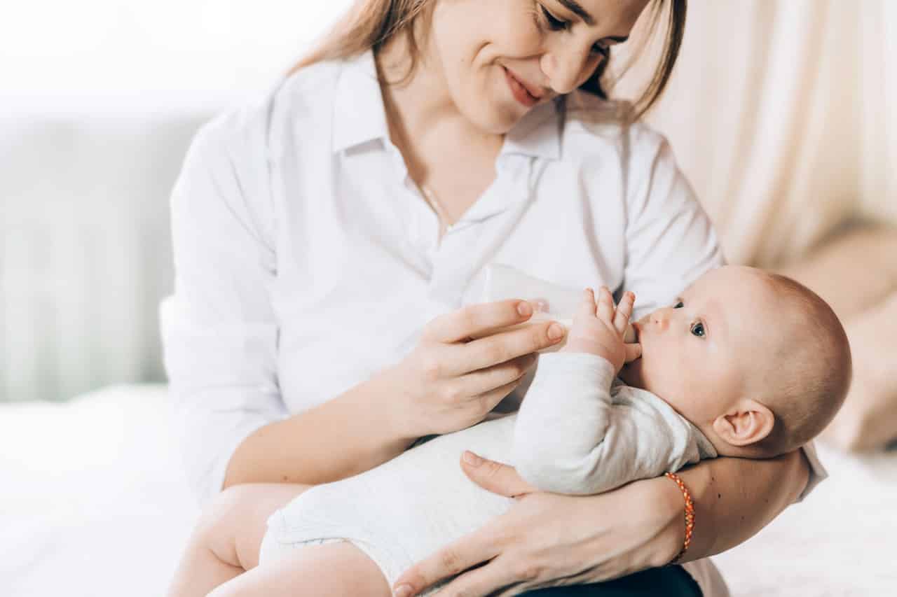 caring mother bottle feeds her newborn baby carin 2021 09 01 23 58 32 utc