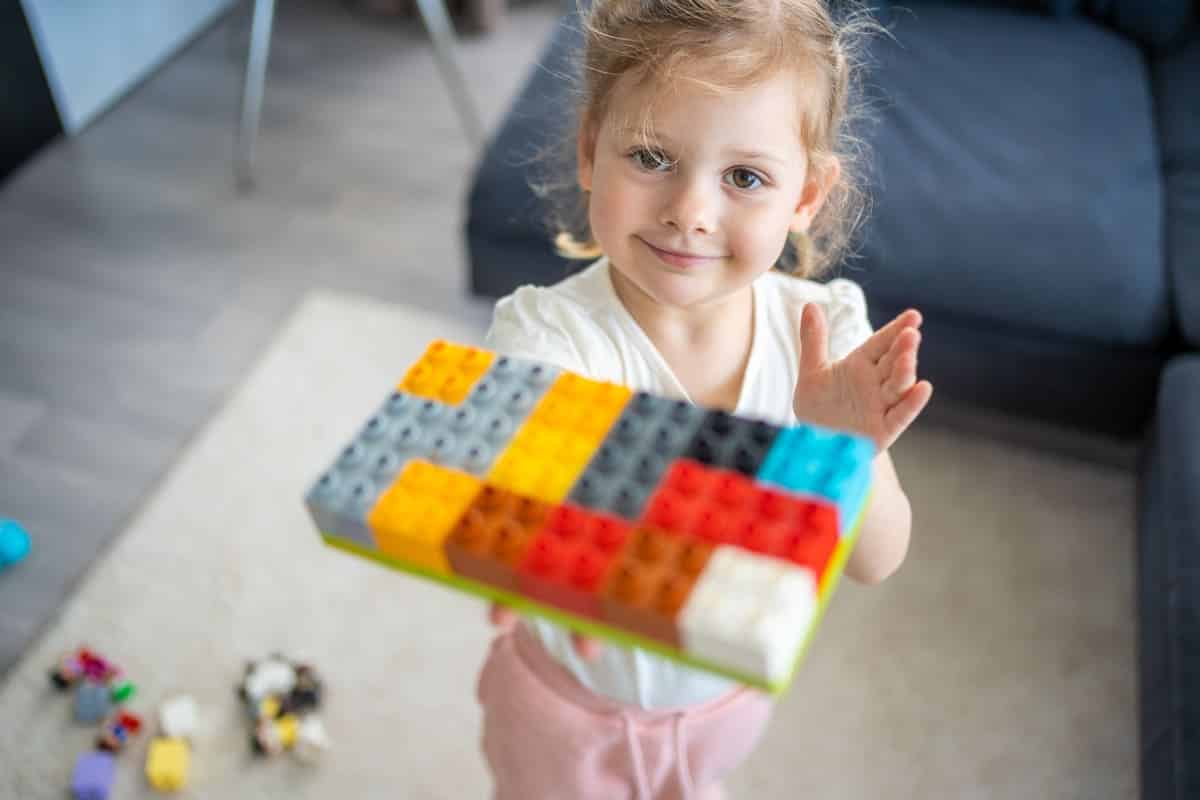 little girl play with constructor toy on floor in 2023 05 13 00 06 53 utc(1)(1)