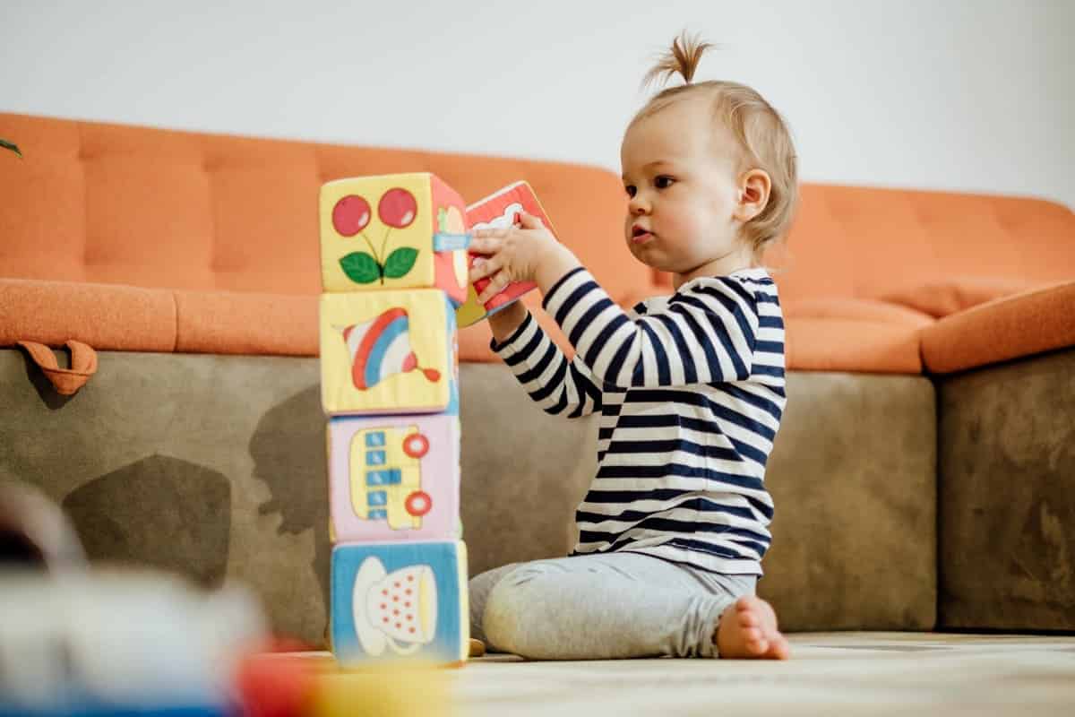 little girl plays with colorful cubes educational 2022 11 10 18 34 19 utc(1)(1)