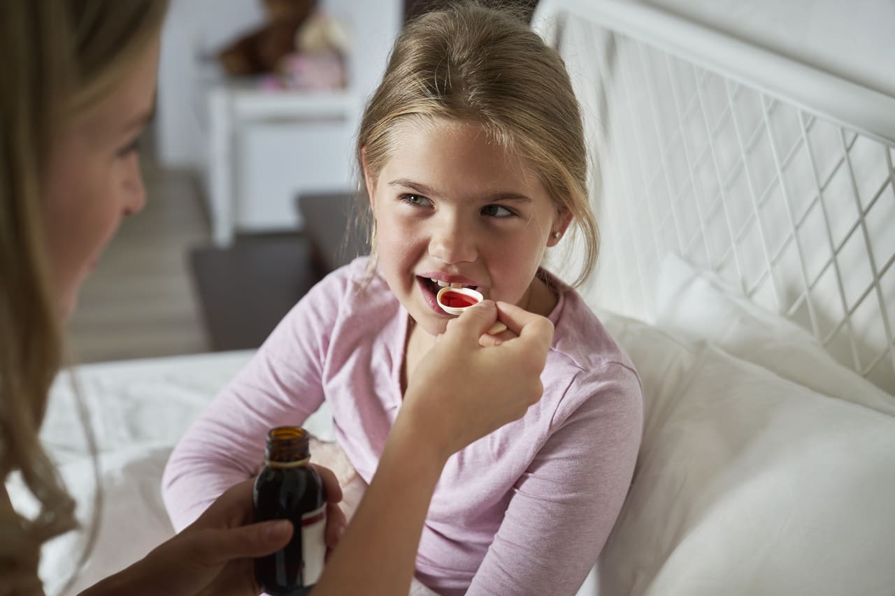 mother giving syrup to an ill girl in bed 2023 09 06 01 54 59 utc