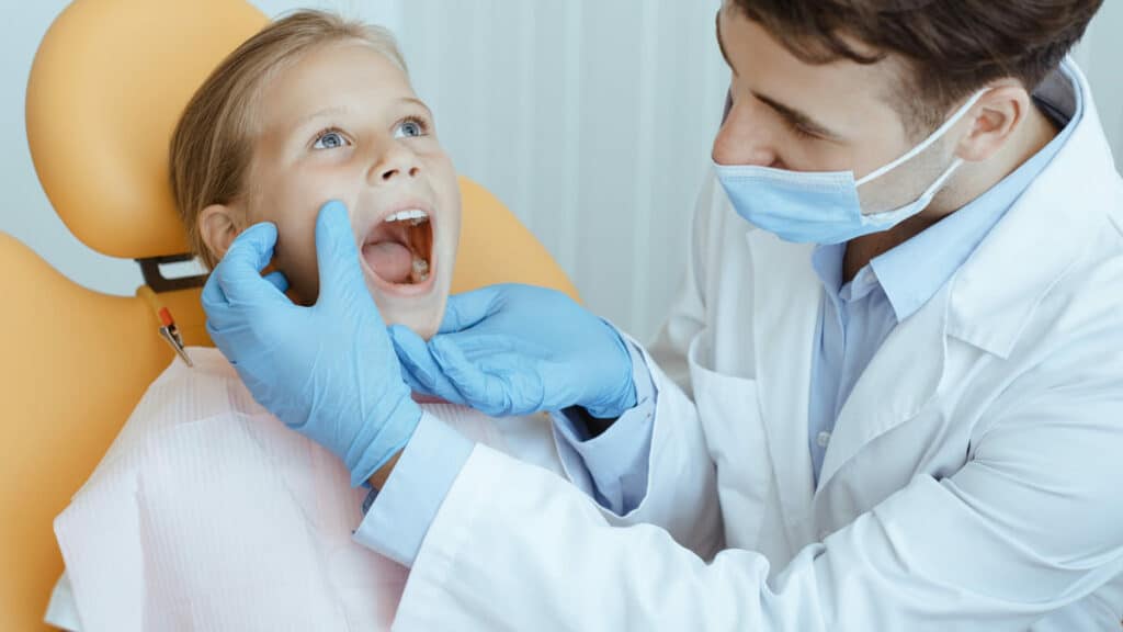hands of unrecognizable pediatric dentist making e 2022 12 16 09 02 09 utc(1)(1)