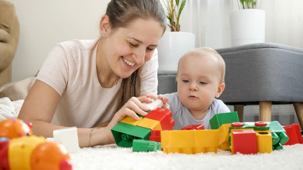 little baby boy with mother playing toys on carpet 2021 12 09 20 23 52 utc(1)(1)