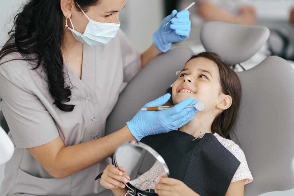 little beautiful girl at the dentist smiling 2021 09 04 06 37 48 utc(1)(1)