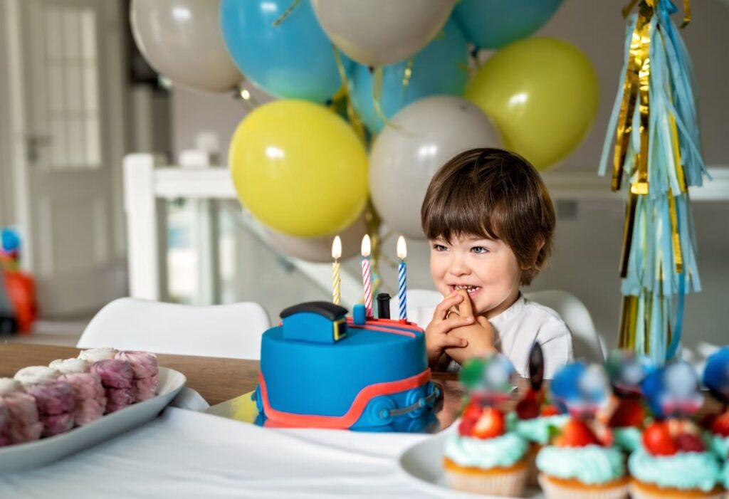 little child celebrating third birthday party blow 2022 11 15 18 05 39 utc