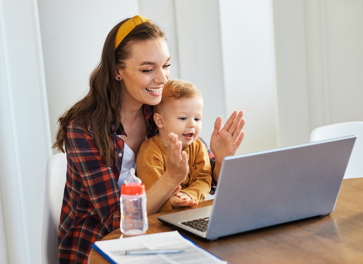 mother baby laptop computer child woman working business parent mom family