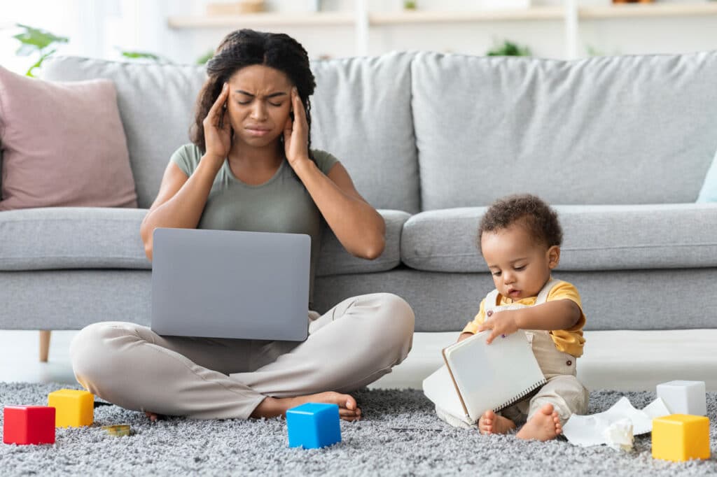 motherhood stress annoyed black mother working on 2022 12 16 09 03 49 utc