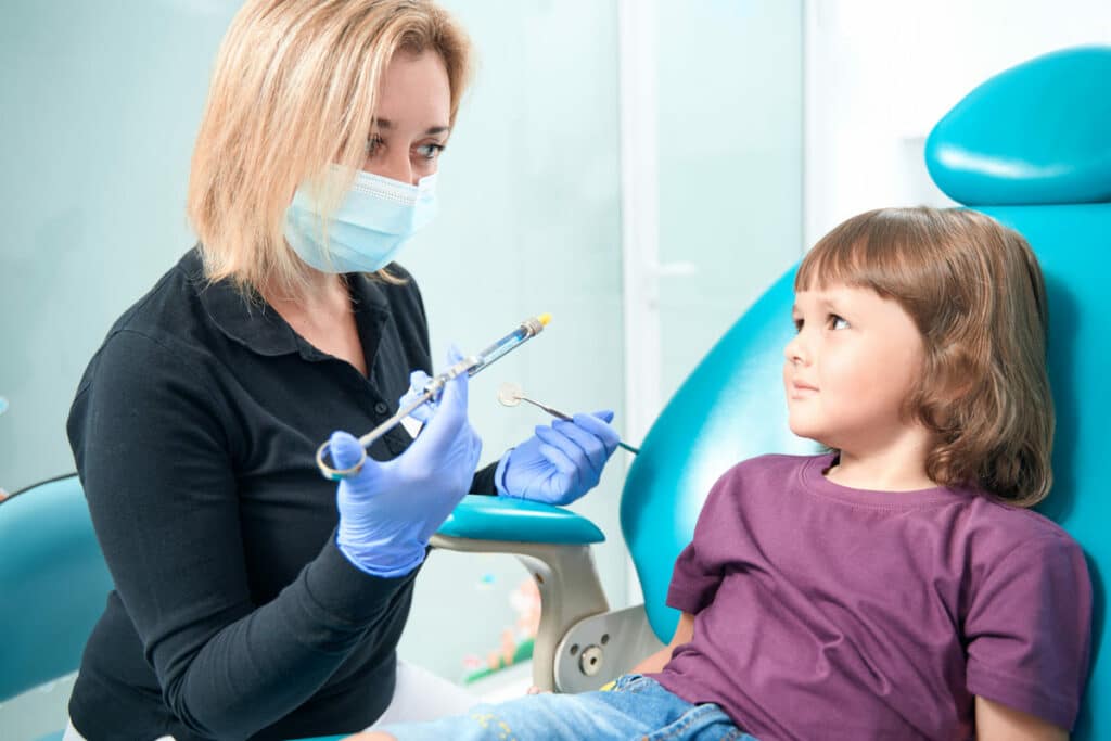 pediatric dentist preparing to administer local an 2022 09 01 17 08 40 utc(1)(1)