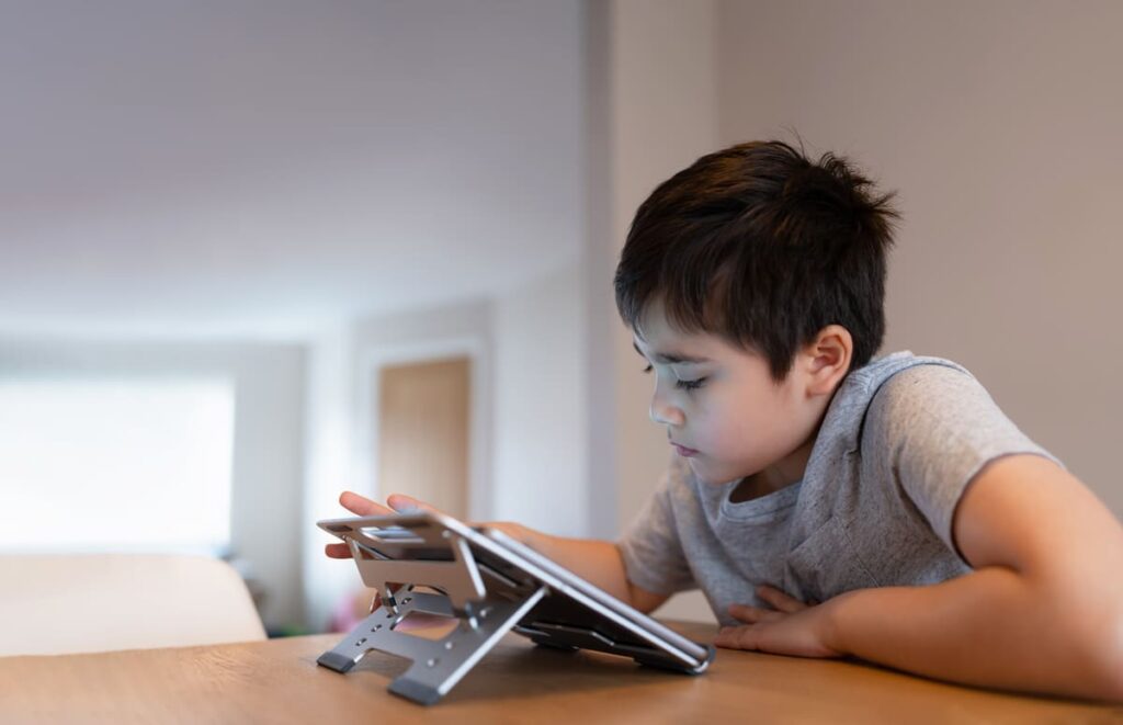 schoolboy doing homework with digital tablet child 2023 11 27 04 56 26 utc(1)(1)