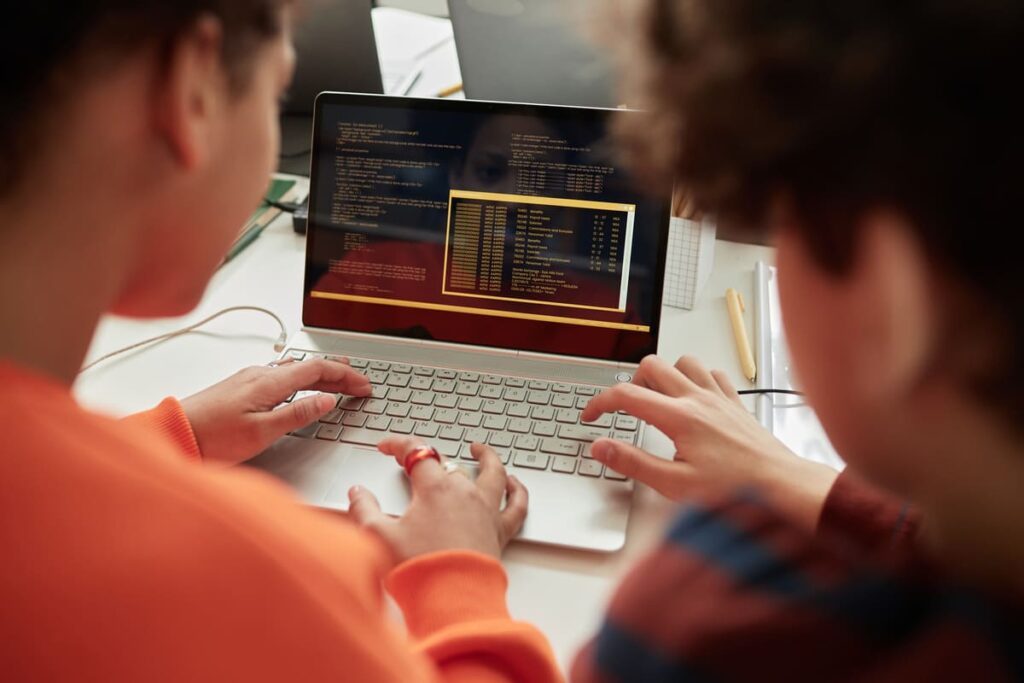 schoolchildren using laptop in computer programmin 2023 05 16 19 05 40 utc(1)(1)