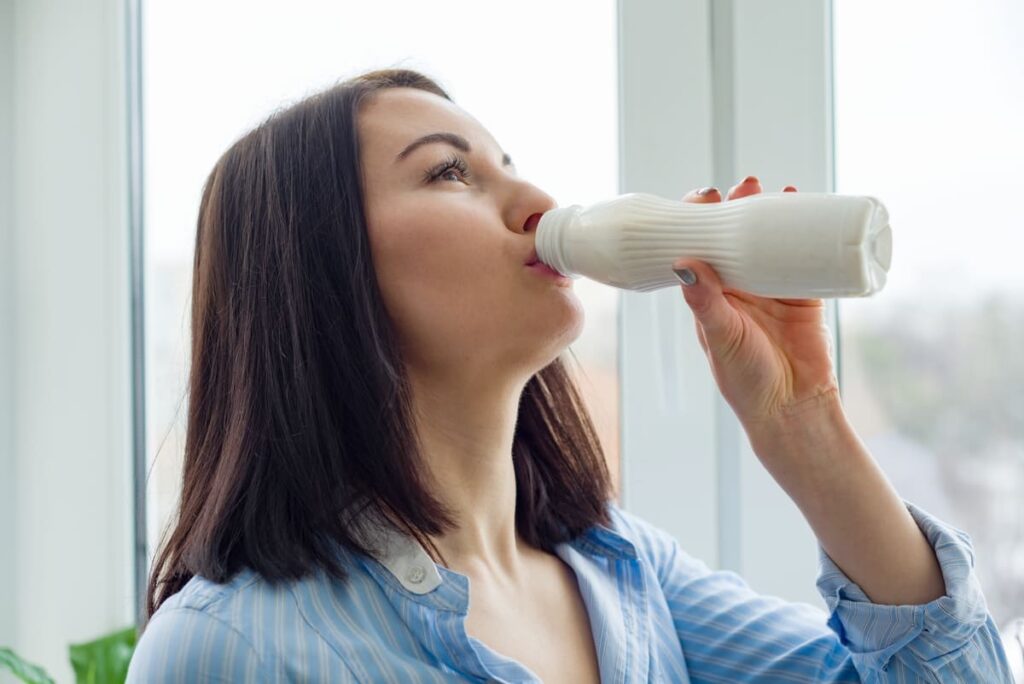 young beautiful woman with bottle of milk yogurt 2022 03 16 22 13 45 utc(1)(1)