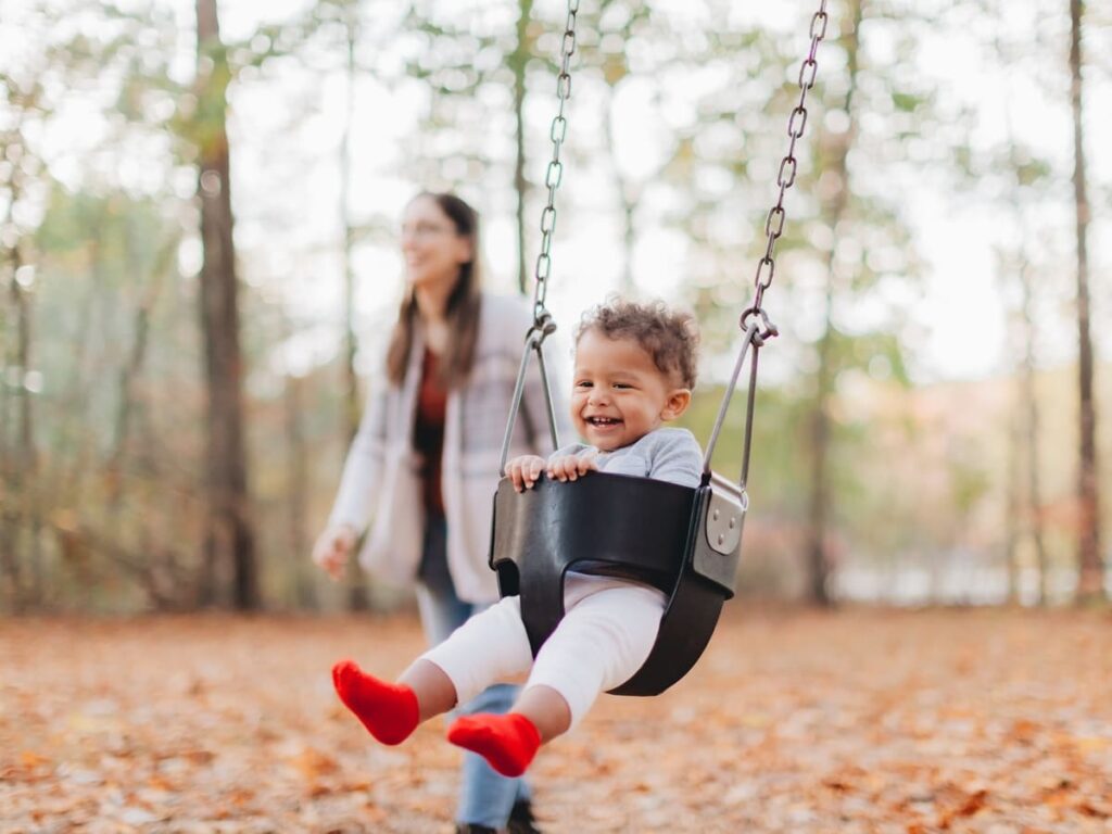 mother having fun at the park with her son on a be 2023 11 27 05 13 09 utc(1)(1)