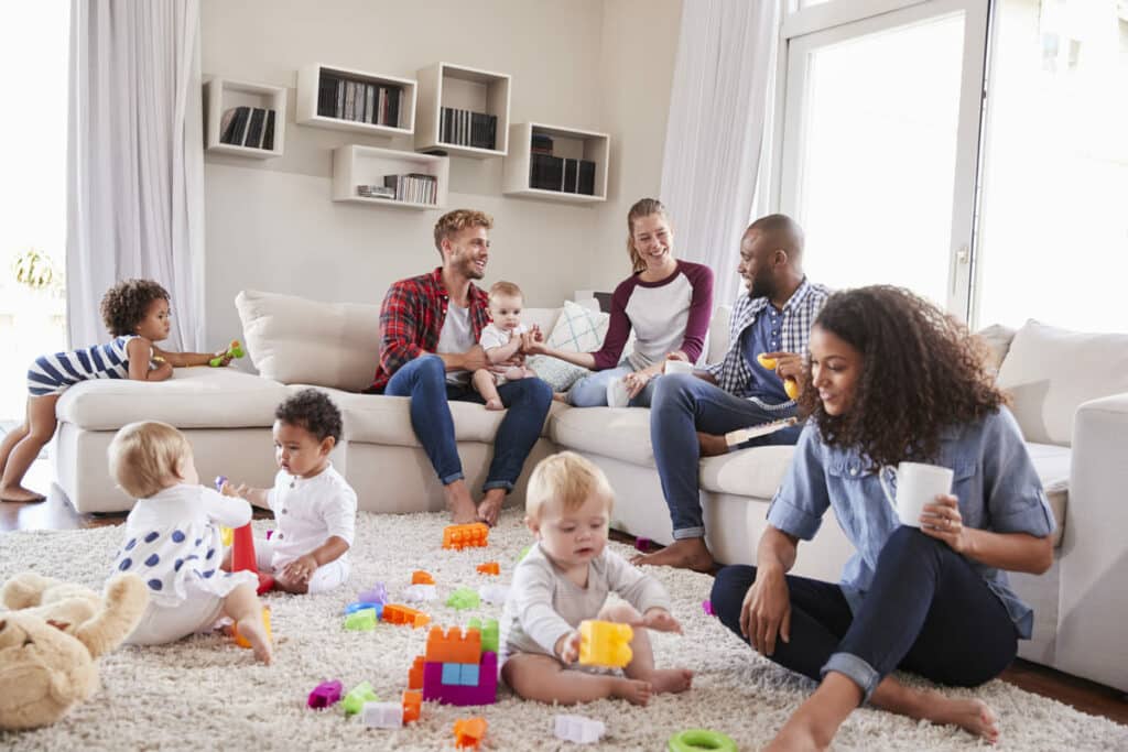 friends with toddlers playing on the floor in sitt 2024 10 19 10 04 15 utc(1)