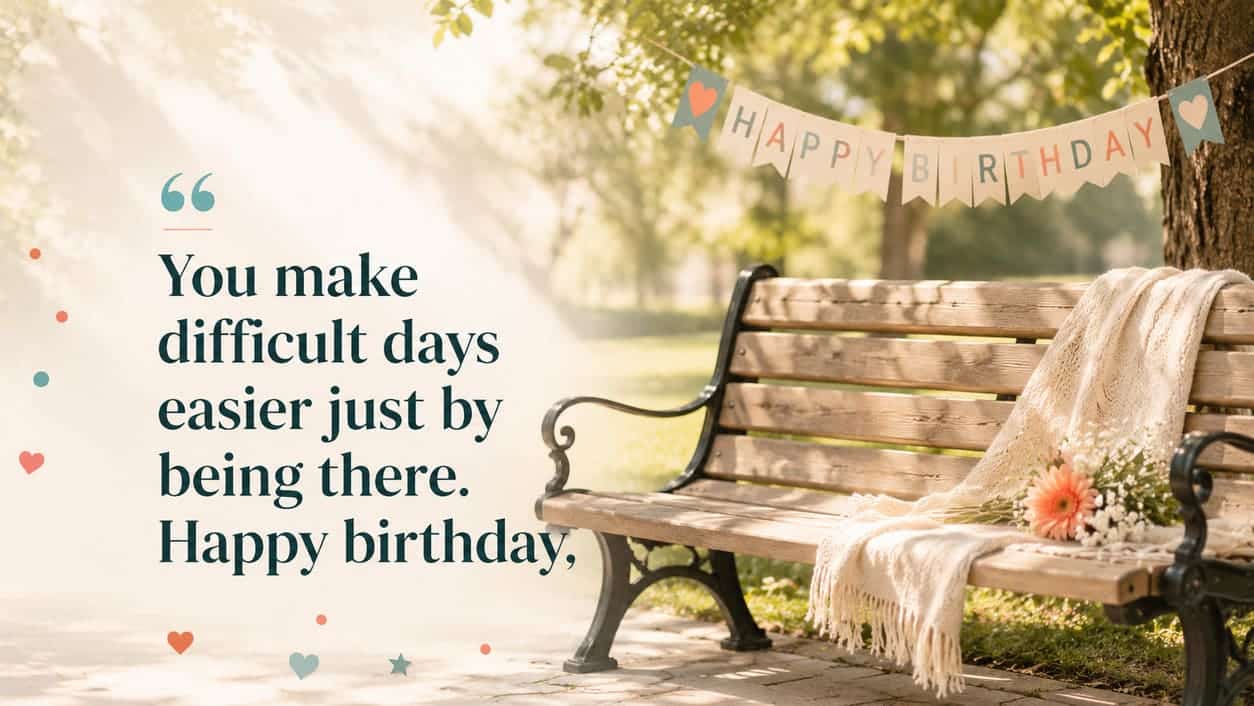 A sunlit park bench stands beside a small birthday banner and an open seat.