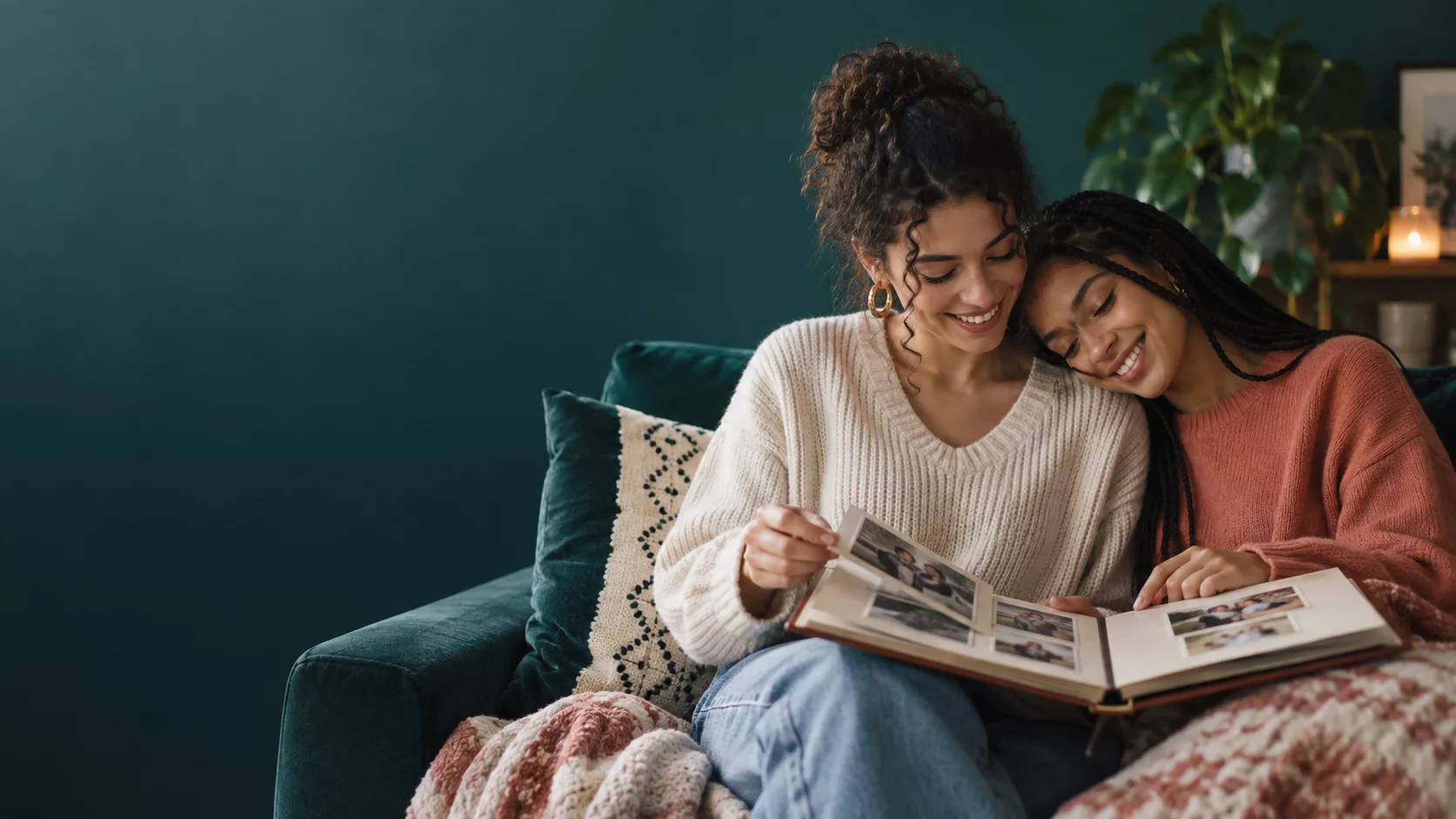 Two sisters looking through a childhood photo album